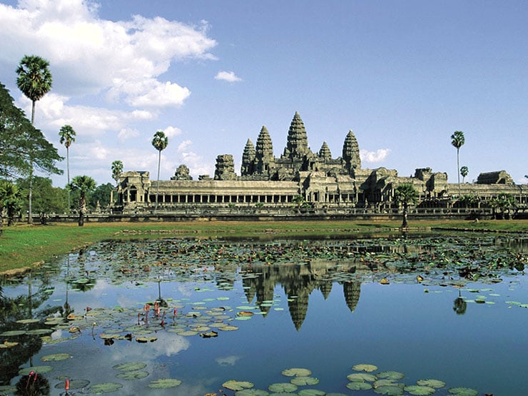 Cambodia Angkor Wat religious temple over water with scenery of lake and sky