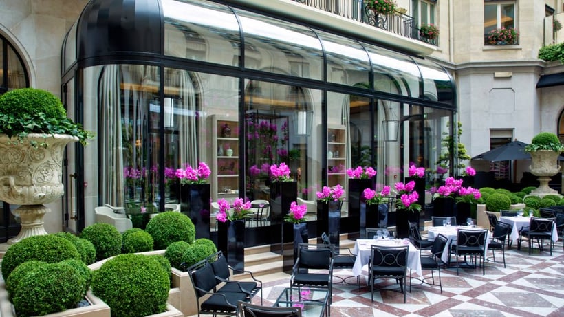 L’Orangerie restaurant patio seating with flowers