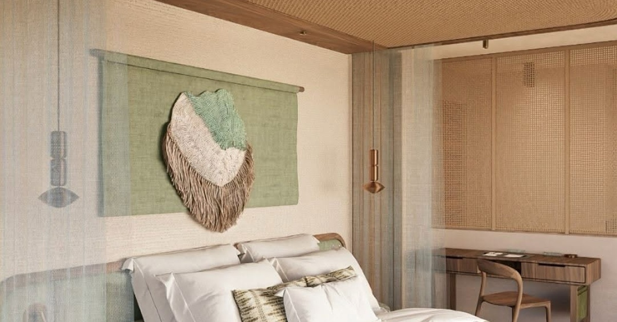 Serene bedroom pairs white linens and sage accents with woven wood details, a canopy screen, and a compact desk.