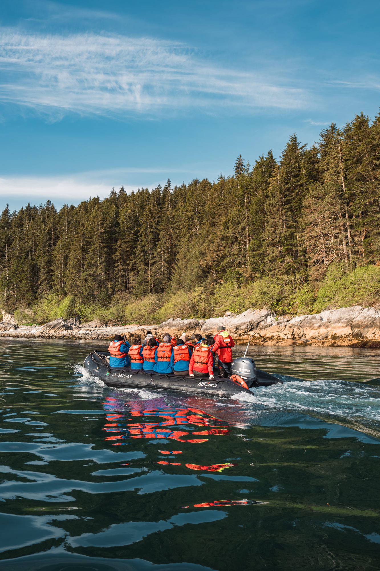 Seabourn guests on a Zodiac excursion along the Alaska shoreline