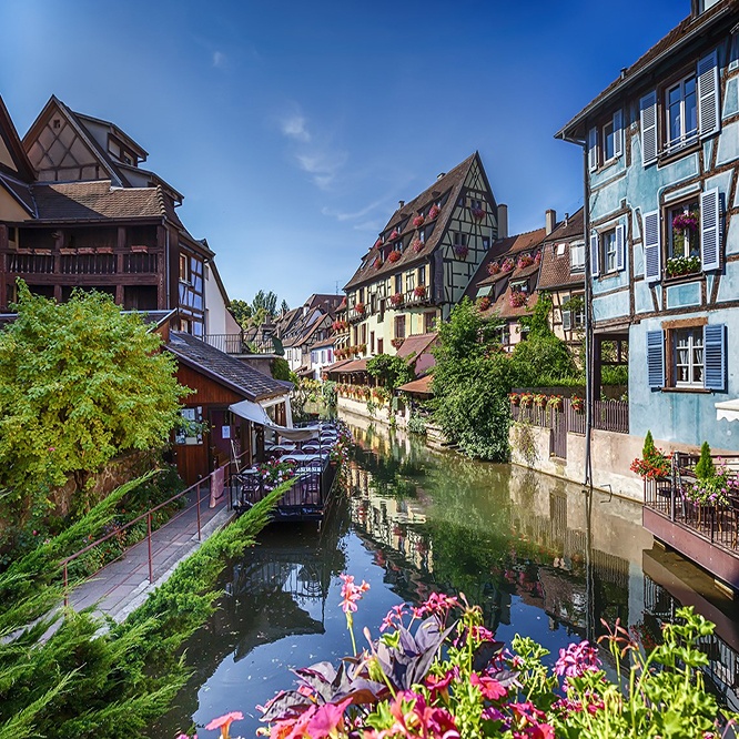 Enchanting Rhine France Strasbourg River Between Houses Flowers and Blue Sky